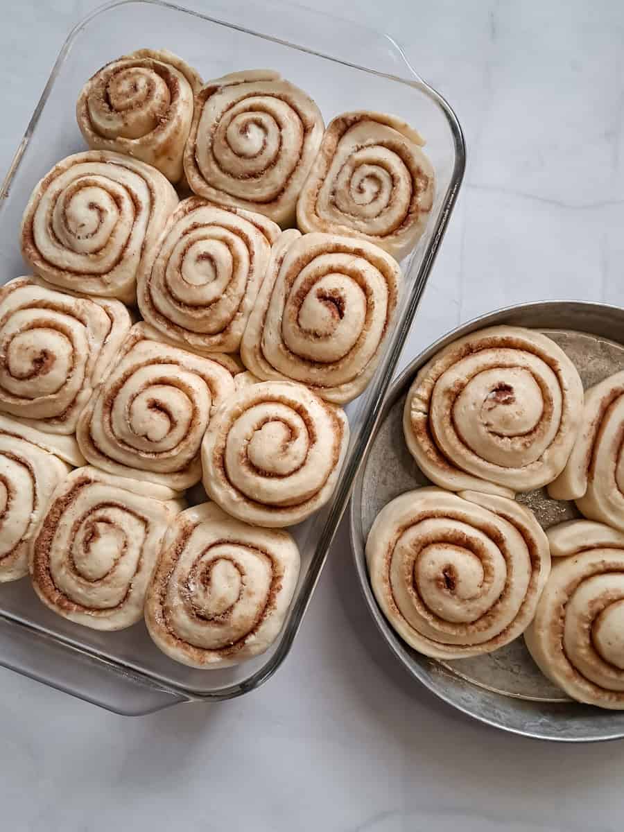 risen cinnamon rolls are ready to bake.