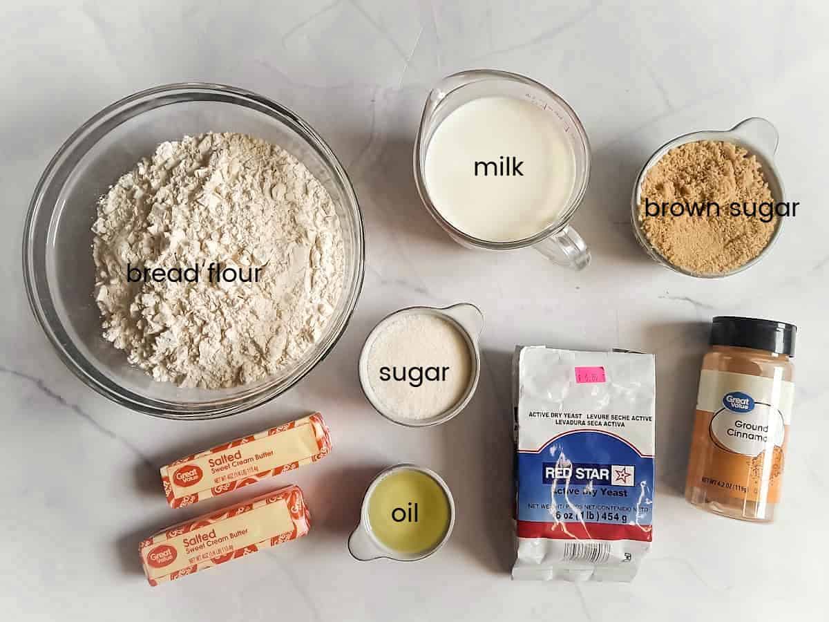Ingredients: bread flour, sugar, oil, butter, yeast, milk, brown sugar, and cinnamon.