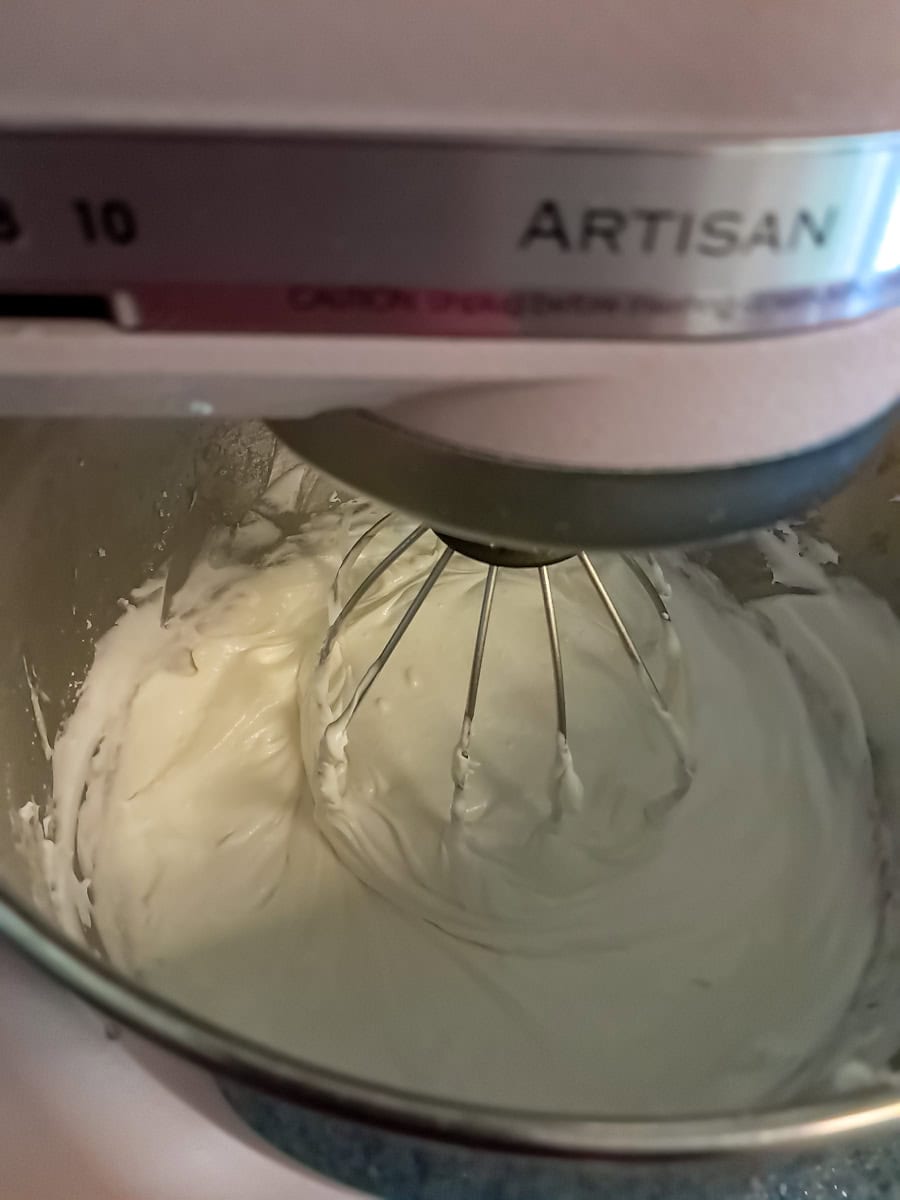 mixing the cream cheese filling in a large mixing bowl.