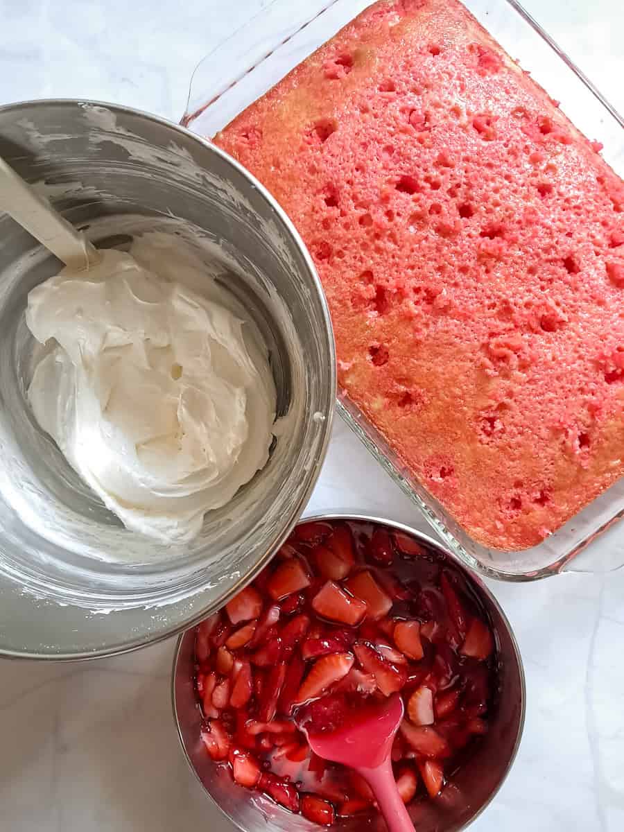 9x13" pan of poke cake, cream cheese filling in another bowl, nd strawberries with glaze in a saucepan.