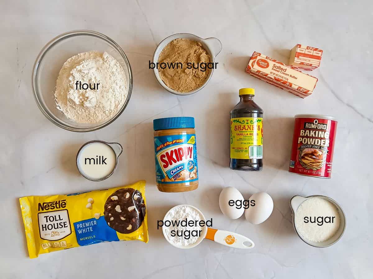 Ingredients: flour, sugar, powdered sugar, brown sugar, eggs, butter, peanut butter, baking powder, vanilla, and white chocolate chips.