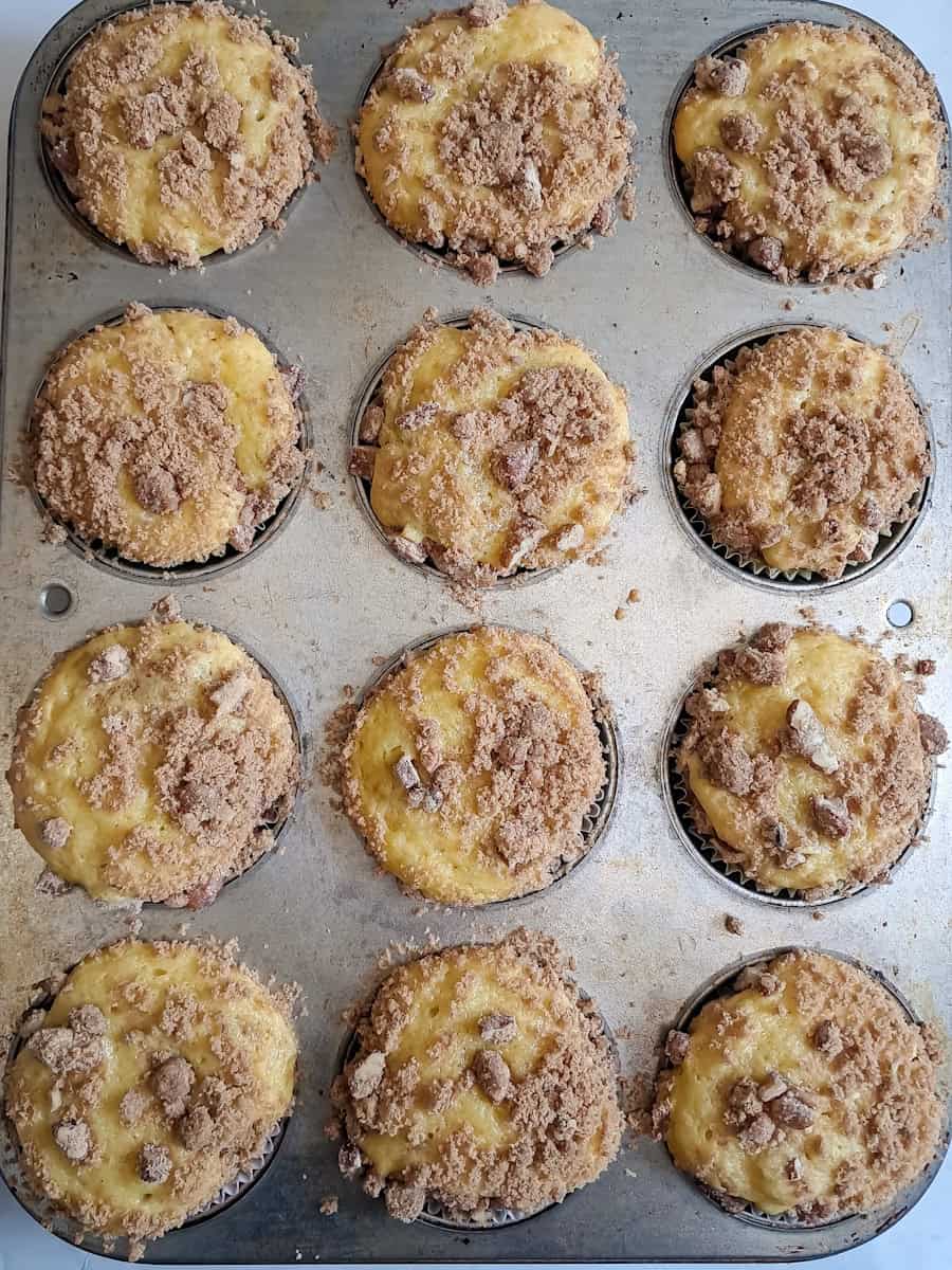 baked cinnamon crumb muffins in the tin.