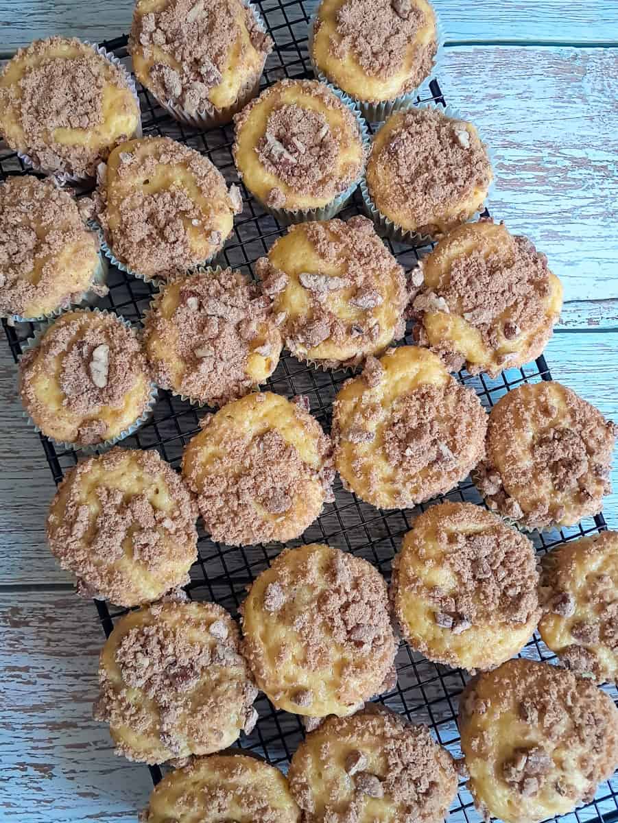 coffeecake muffins cooling on a wire rack.