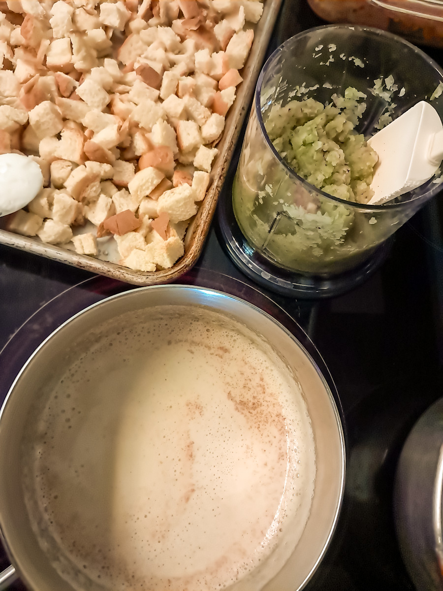 cut bread cubes on large tray, butter in saucepan, and chopped veggies in chopper container.