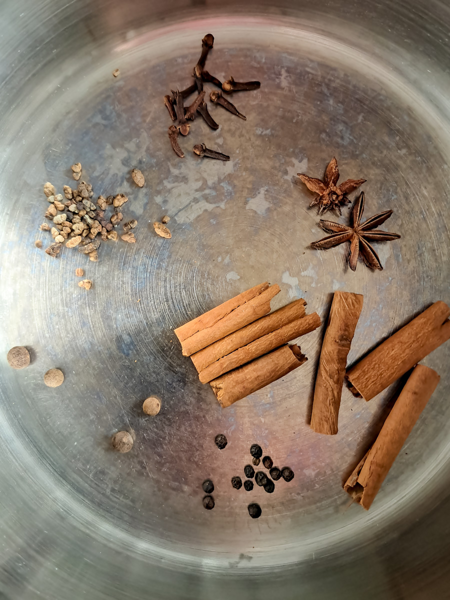 toasting the spices in a pot.