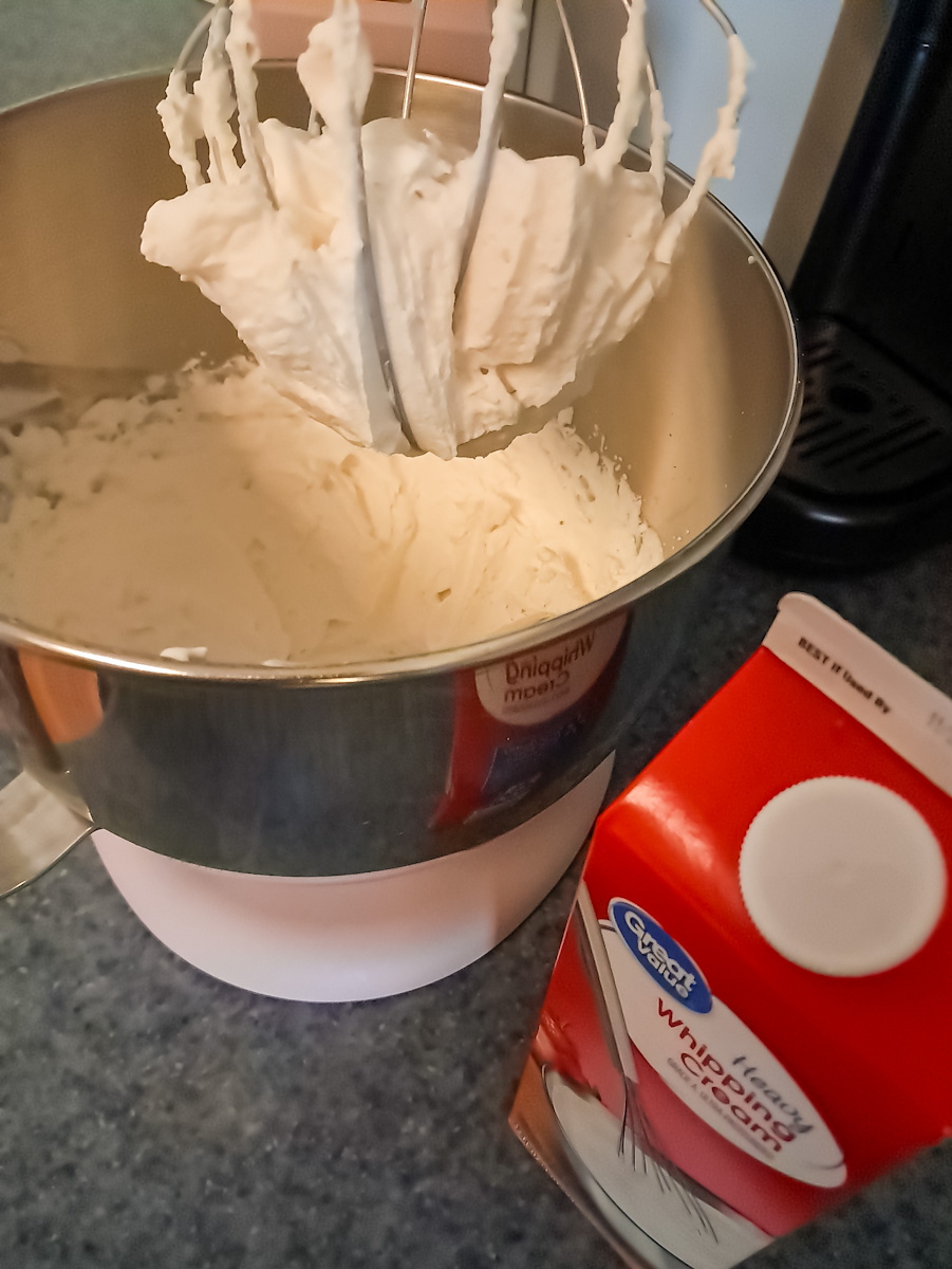 whipping heavy cream in a bowl.