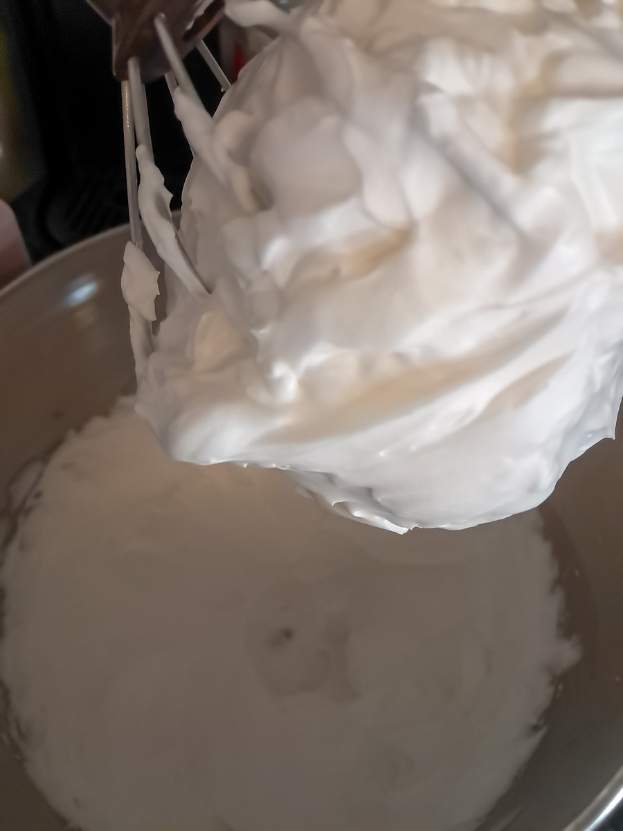 beating egg whites to stiff peaks.