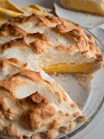 A 9" Amish lemon meringue pie with a slice removed.