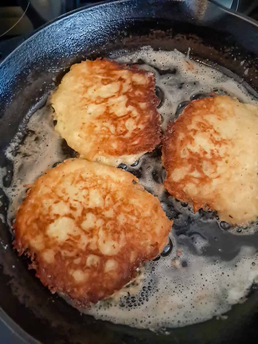 frying potato pancakes until they are nicely browned.