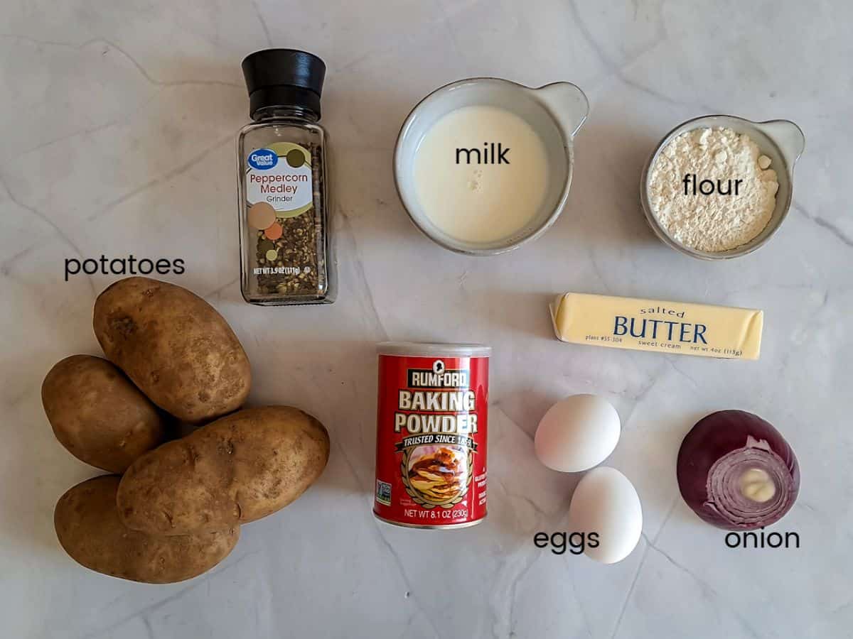 Ingredients: potatoes, flour, baking powder, pepper, butter, onion, eggs, and milk.