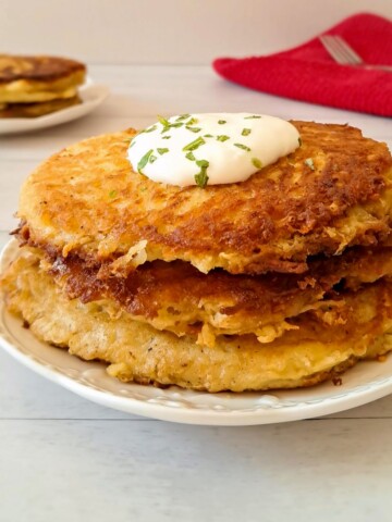 a stack of nicely browned Amish potato pancakes made with grated potatoes.
