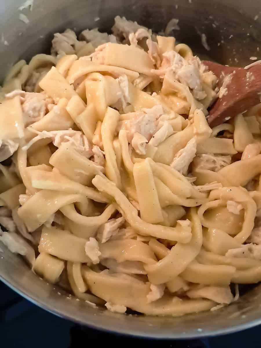 a pot of cooked Amish chicken and noodles.