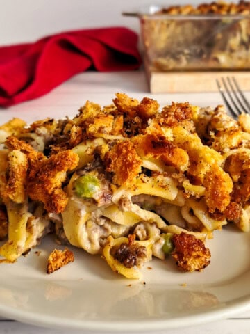 a plate full of Amish yumasetti casserole - beef and noodle casserole.