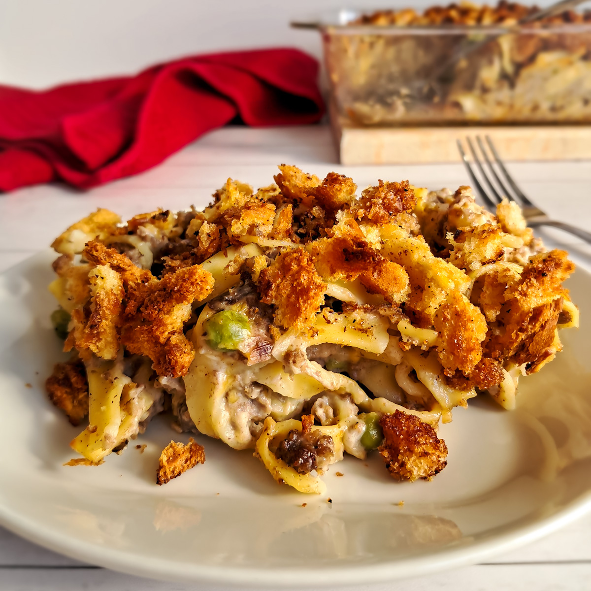 a plate full of Amish yumasetti casserole - beef and noodle casserole.