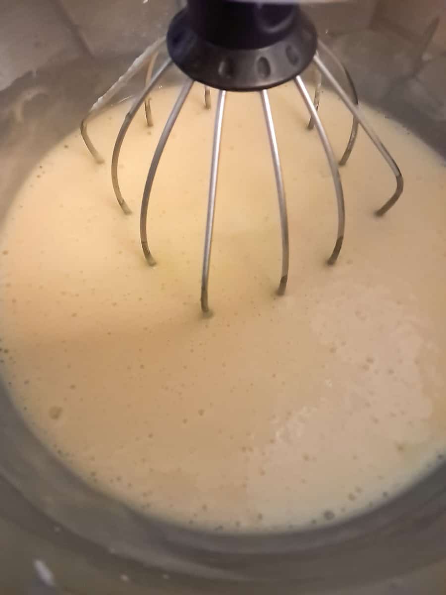 mixing the buttermilk pie filling in a large mixing bowl.