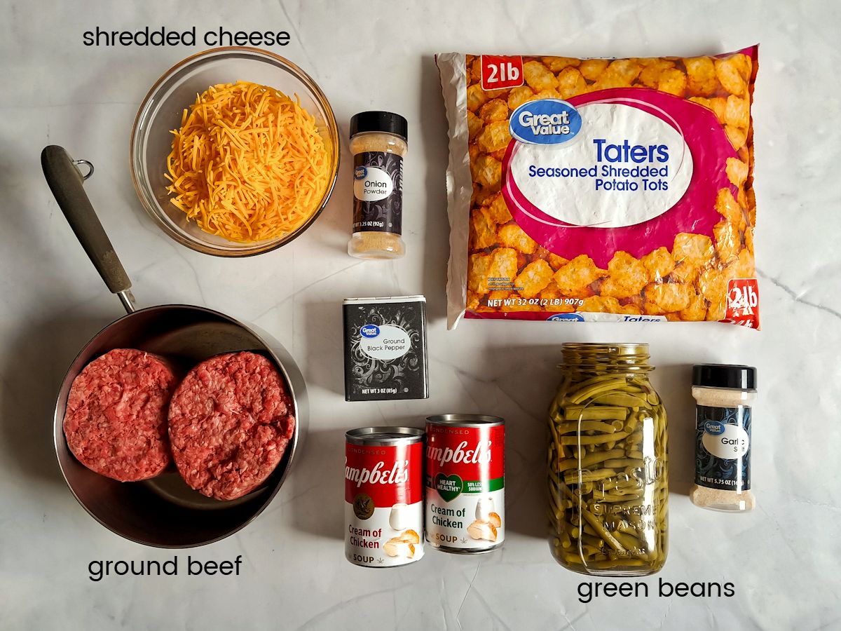 Ingredients: tater tots, ground beef, cheese, green beans, cream soups, pepper, garlic salt, and onion powder.