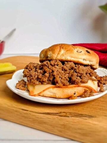 Amish sloppy joe filling inside a sandwich bun.