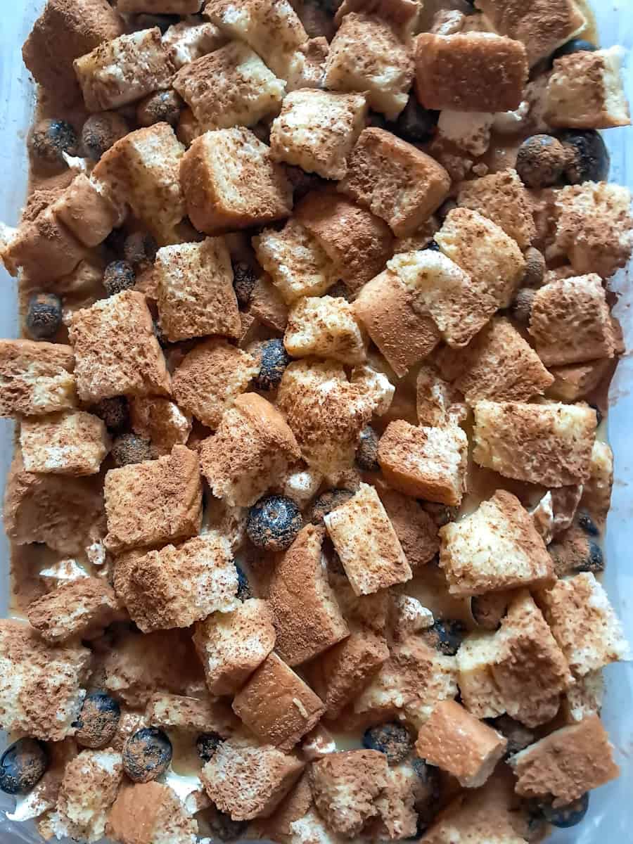 cinnamon sprinkled over the top of the french toast casserole and now it's ready to bake.