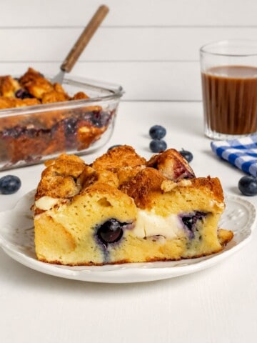 a slice of Amish stuffed French toast with blueberries on a small plate.