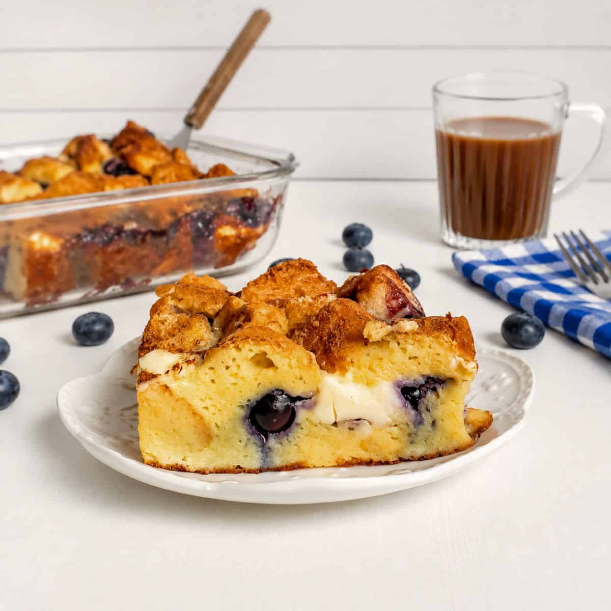 a slice of Amish stuffed French toast with blueberries on a small plate.