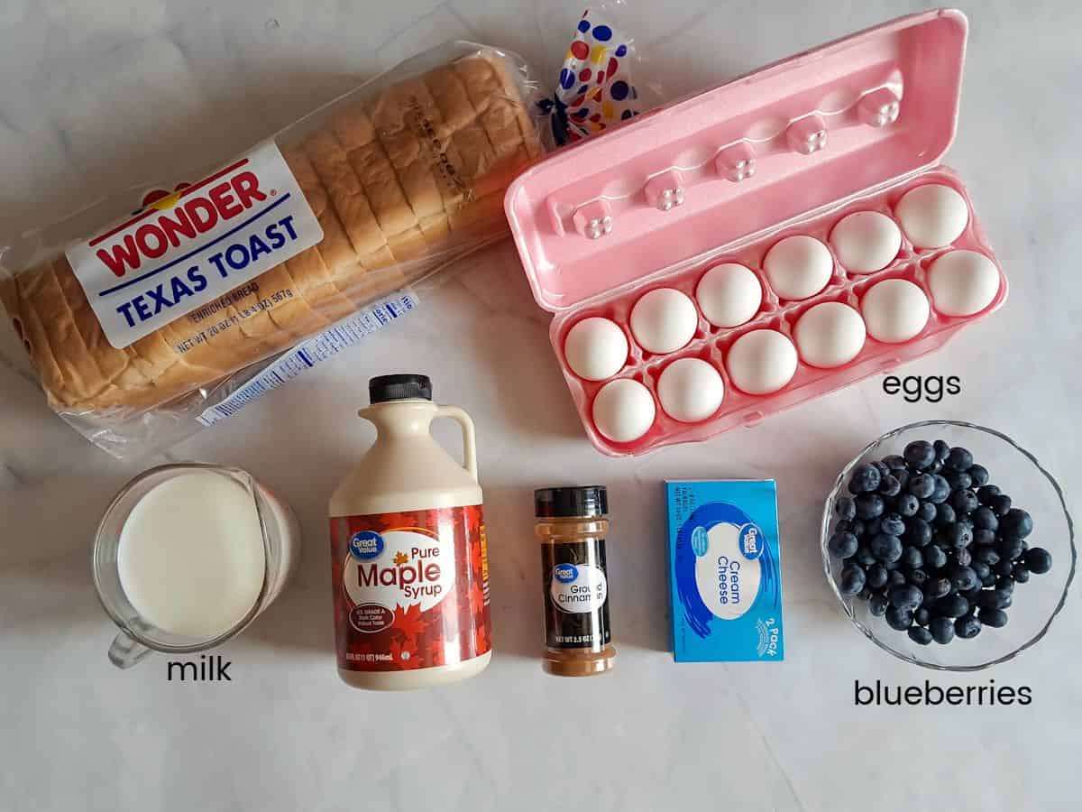 Ingredients: bread, eggs, milk, cream cheese, blueberries, maple syrup, and cinnamon.