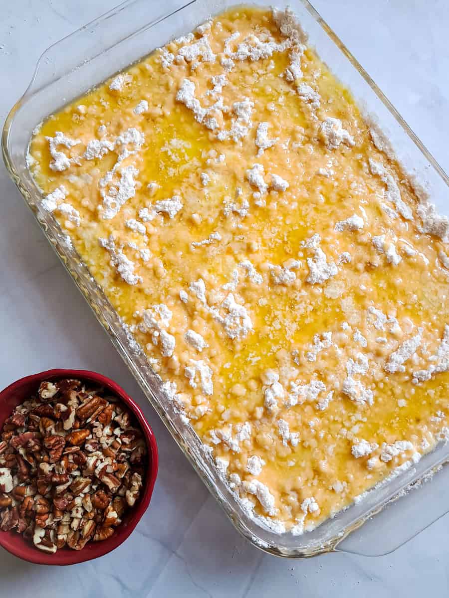 cake is ready to bake, and we'll put the bowl of chopped pecans on top after it's partially baked.
