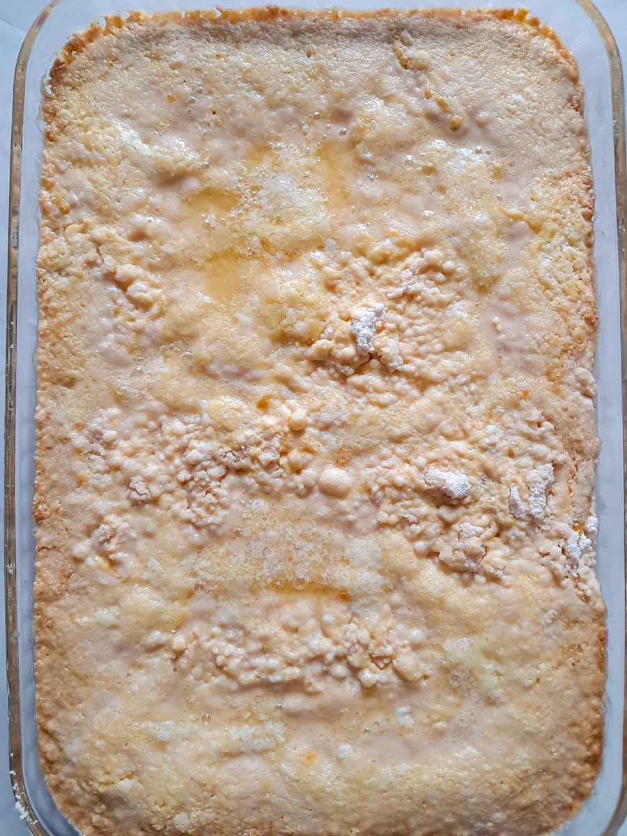 partially baked 9x13" cake, ready to be topped with pecans.